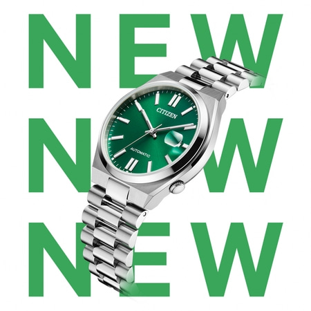 Montre Citizen avec cadran vert et bracelet argenté, avec texte 'NOUVEAU'.